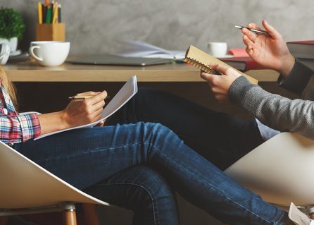 Male and female doing paperwork